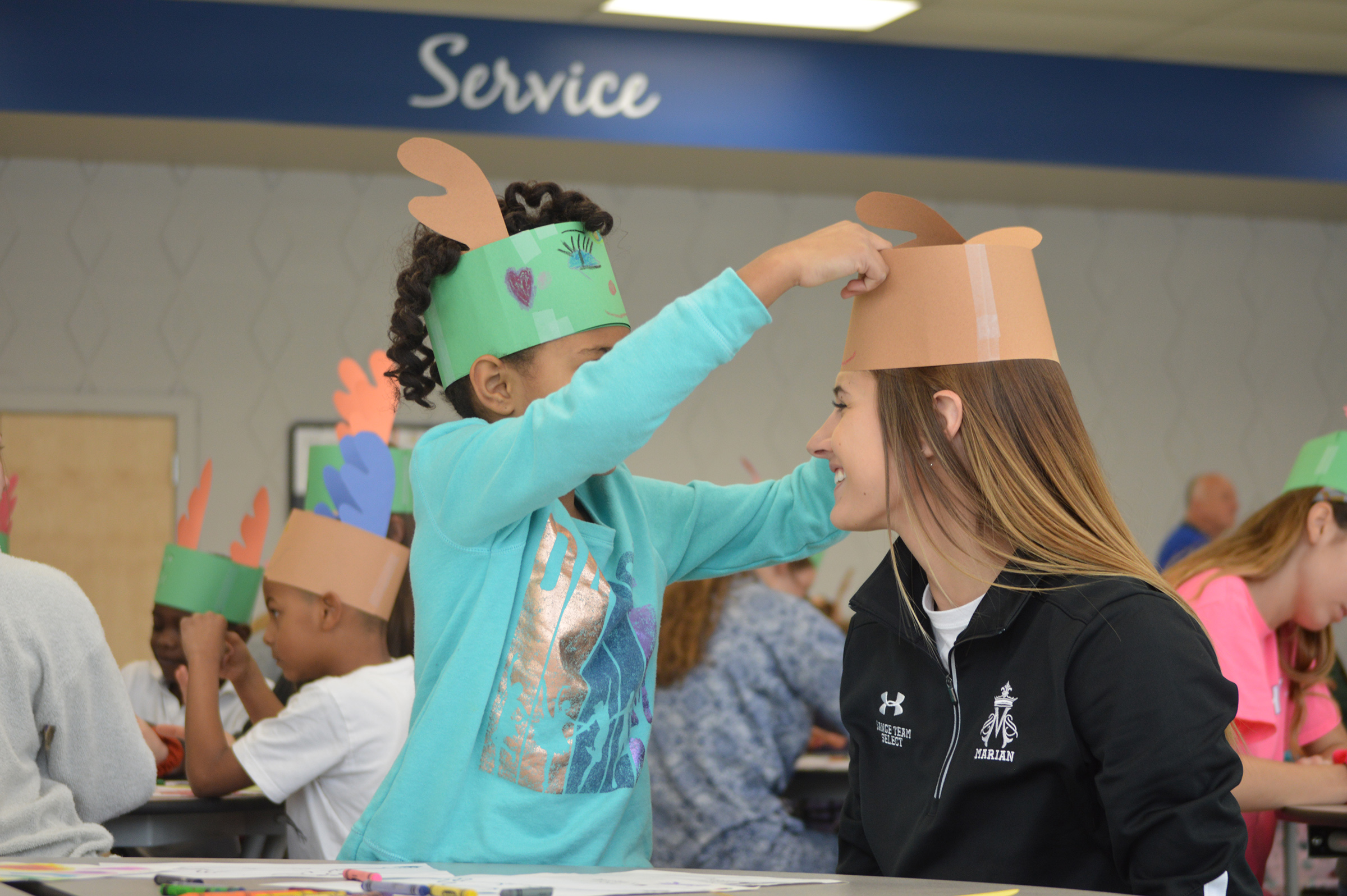 Students collaborate and create stories for Holy Name students